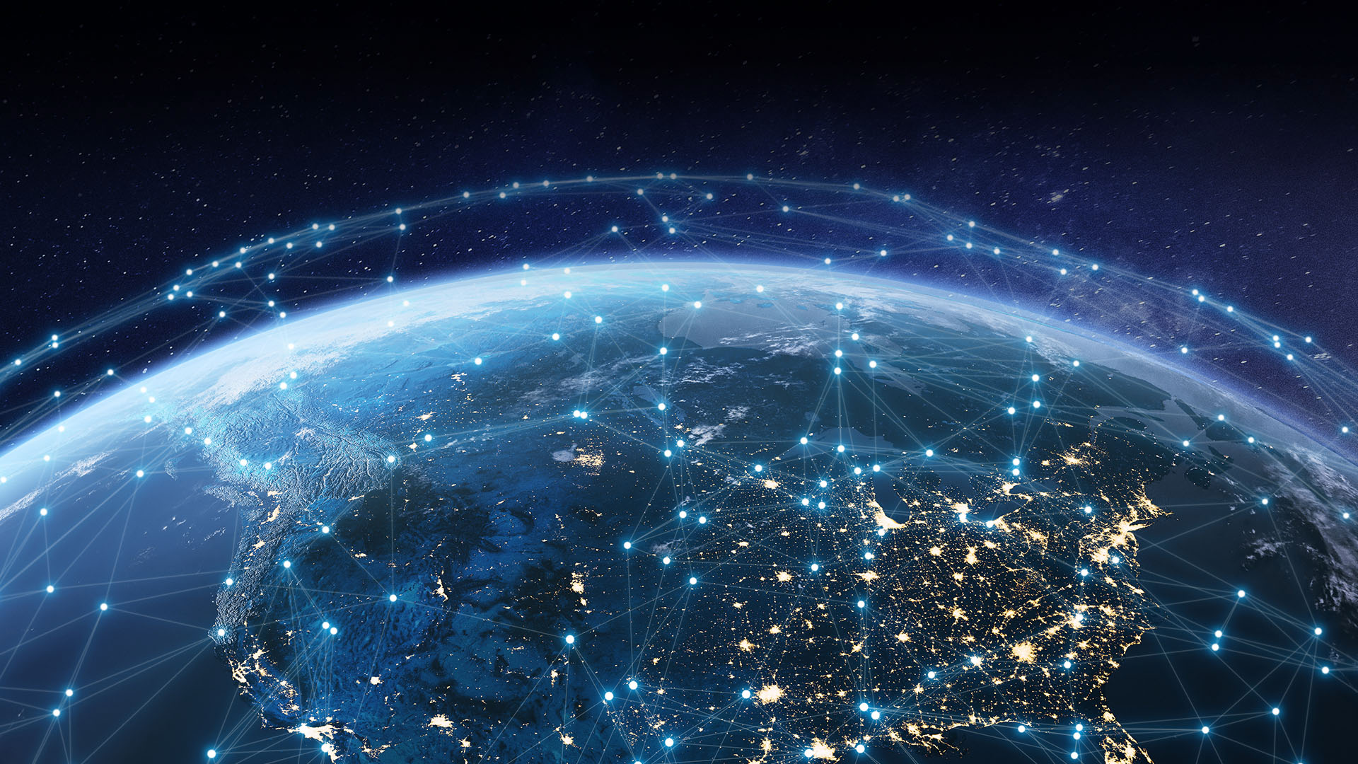 Telecommunication network above North America from space by night with city lights in USA, Canada and Mexico, satellite orbiting Planet Earth for Internet of Things IoT and blockchain technology.